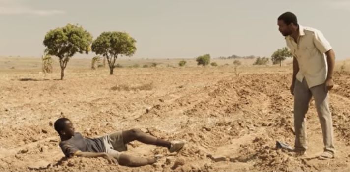 Chiwetel Ejiofor and Maxwell Simba on bare soil as seen in trailer of The Boy Who Harnessed The Wind" Available Soon (Photo: Netflix)